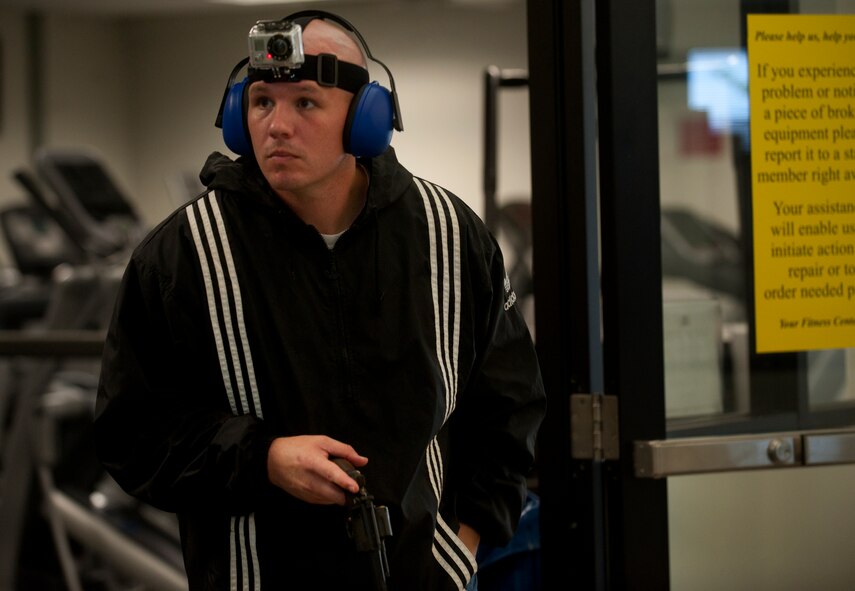 U.S. Air Force Tech. Sgt. Clint Ellis, 23rd Security Forces Squadron plans and programs NCO in-charge, reloads his revolver during his last stand as gunman during an active shooter exercise June 24, 2011, at Moody Air Force Base, Ga. The exercise is an annual requirement for the wing to test its ability to respond to an active shooter. (U.S. Air Force photo by Airman 1st Class Jarrod Grammel/Released)
