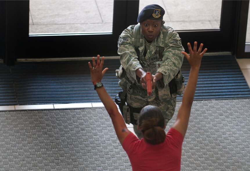 U.S. Air Force Staff Sgt. Ashley Darden, 23rd Security Forces Squadron security forces leader, gives instructions to a victim shortly after entering the Freedom I Fitness Center during an active shooter exercise June 24, 2011, at Moody Air Force Base, Ga. Sergeant Darden and her partner were the first responders to enter the building. (U.S. Air Force photo by Airman 1st Class Jarrod Grammel/Released)
