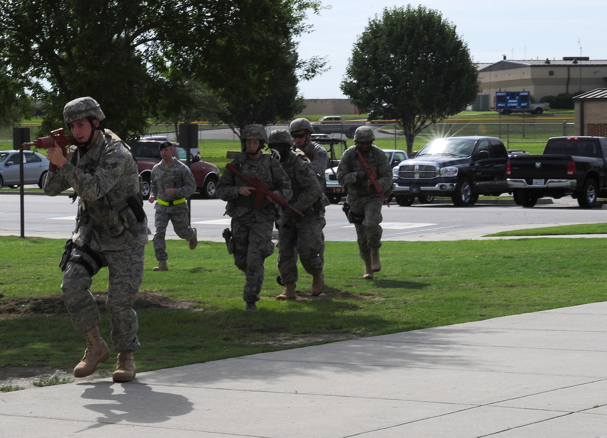 A five-man team with the 23rd Security Forces Squadron makes its way to the Freedom I Fitness Center at Moody Air Force Base, Ga., during an active shooter exercise June 24, 2011. Security forces successfully cleared the building, evacuated the injured hostages and detained the gunman.  (U.S. Air Force photo by Senior Airman Stephanie Mancha/Released)