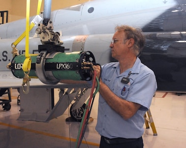 Arlyn King, 12th Flying Training Wing Maintenance Division non-destructive inspection technician, aims a x-ray machine to check for stress cracks on a T-38 Talon aircraft on Randolph AFB June 24, 2011 (U.S. Air Force photo/Rich McFadden) (released)