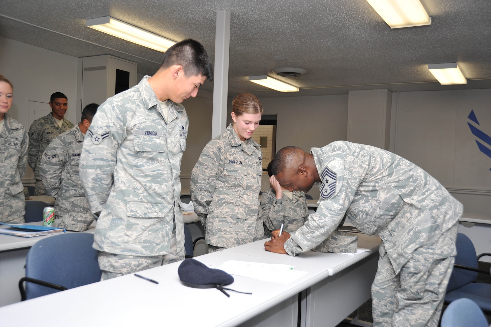 Chief Master Sgt. Juan Lewis, 502nd Air Base Wing command chief looks at the goal cards of Airmen during a Joint Base San Antonio First Term Airman's Class held at Lackland.
(U.S. Air Force photo/)