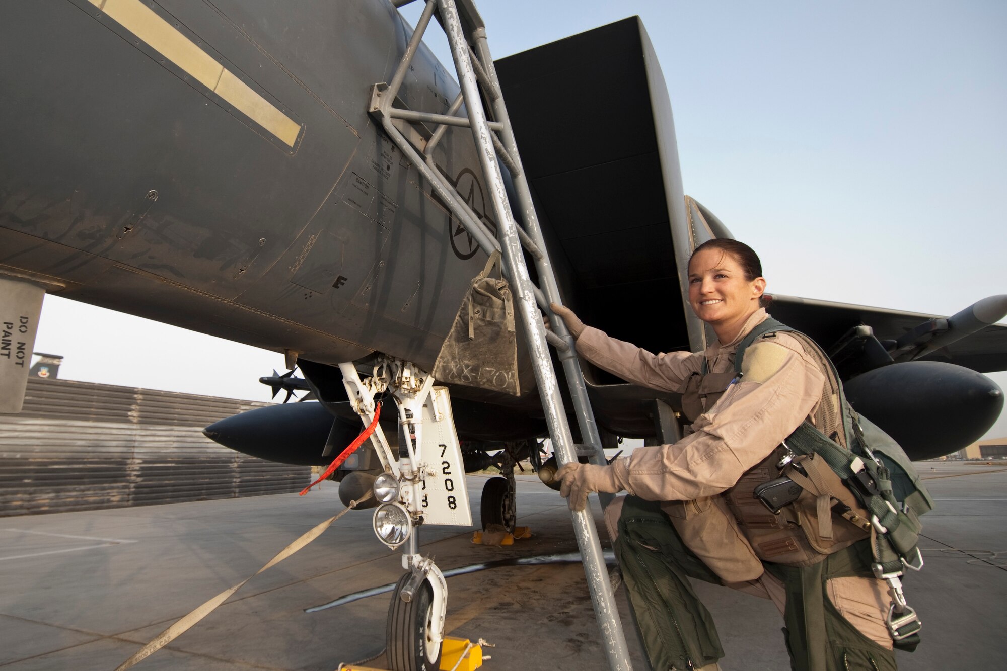 BAGRAM AIRFIELD, Afghanistan -- Capt. Leigh “Breaker” Larkin, a weapons system officer from the 389th Fighter Squadron here, climbs aboard an F-15E Strike Eagle here June 28. Captain Larkin was recently named one of four Airmen to receive the 2010 Mackay Trophy for her part in a combat mission near Turkmenistan April 6, 2010. The award is administered by the United States National Aeronautic Association and is awarded yearly by the United States Air Force for the "most meritorious flight of the year" by an Air Force person, persons, or organization. (U.S. Air Force photo by Staff Sgt. Jorge Intriago)