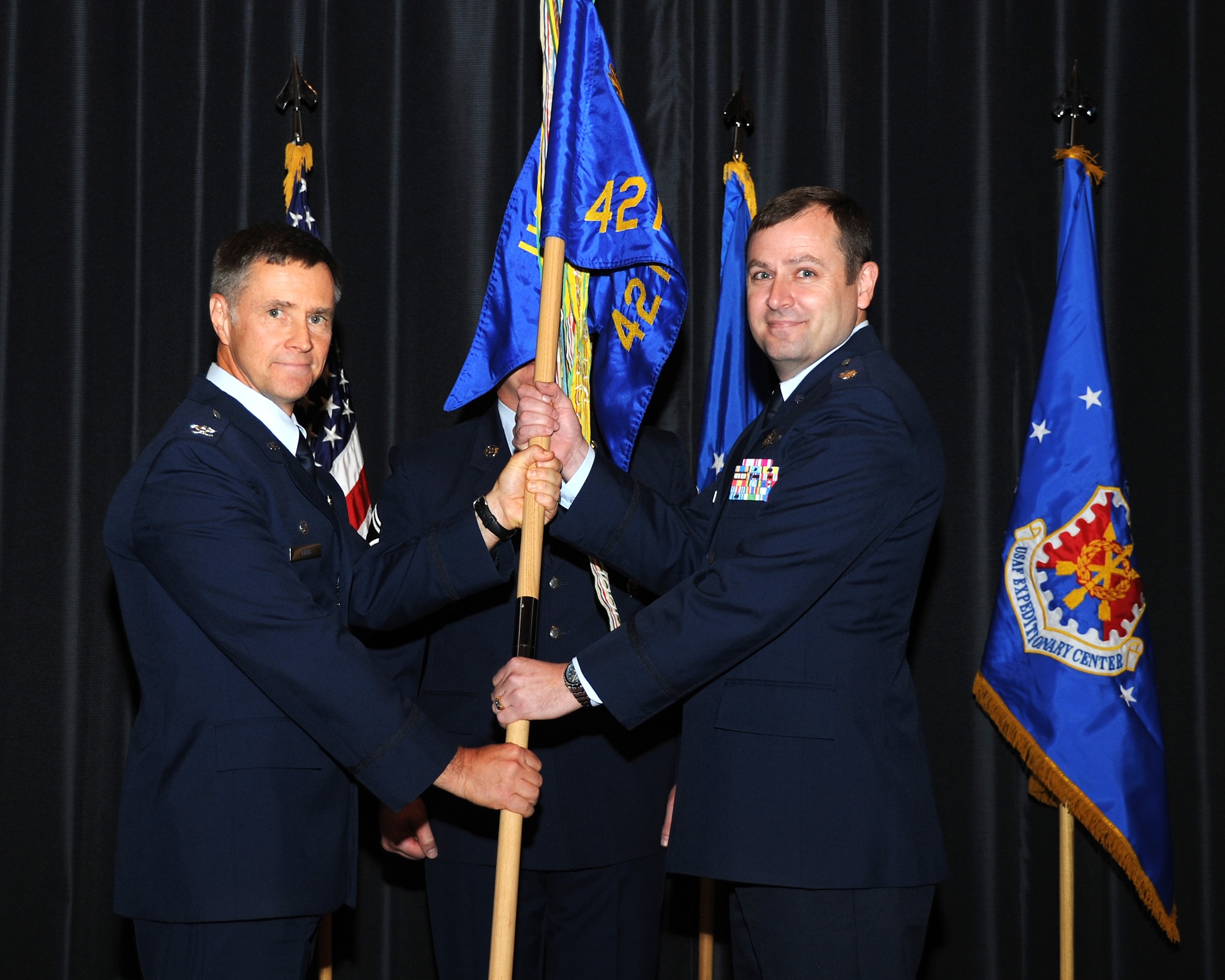 Lt. Col. Rhett Boldenow (right) takes command of the
421st Combat Training Squadron from Col. Mark Ellis (left) during a
change-of-command ceremony June 24 at Joint Base McGuire-Dix-Lakehurst, N.J.
(U.S. Air Force photo by Staff Sgt. Nathan Bevier/Released)
