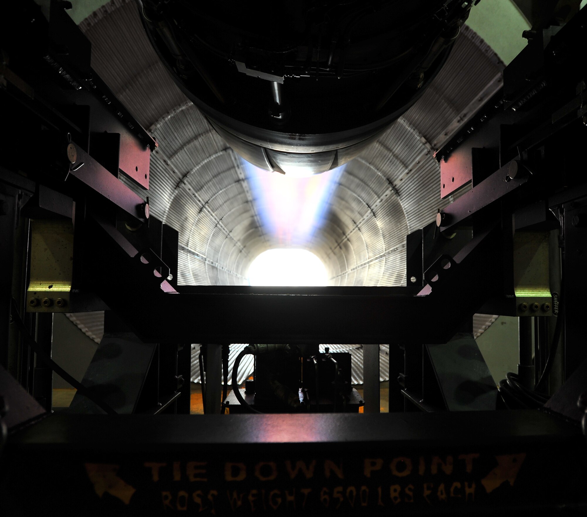 SPANGDAHLEM AIR BASE, Germany – A turbine engine shoots flames while testing afterburner functions inside the hush house here June 27. The hush house is a sound controlled hangar used to test turbine engines for malfunctions before they are mounted on aircraft. (U.S. Air Force photo/Airman 1st Class Dillon Davis)