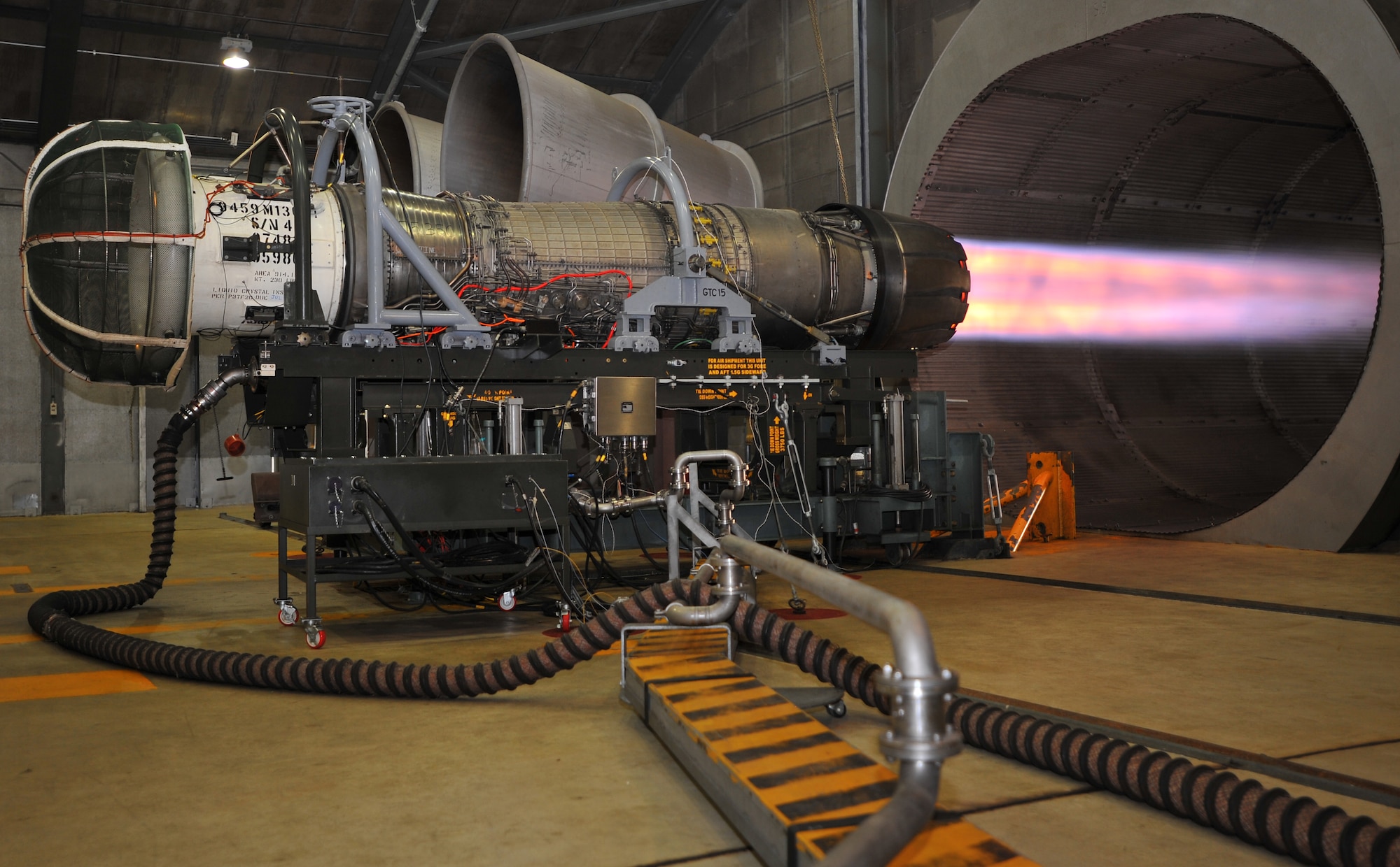 SPANGDAHLEM AIR BASE, Germany – A turbine engine shoots flames while testing afterburner functions inside the hush house here June 27. The hush house is a sound controlled hangar used to test turbine engines for malfunctions before they are mounted on aircraft. (U.S. Air Force photo/Airman 1st Class Dillon Davis)