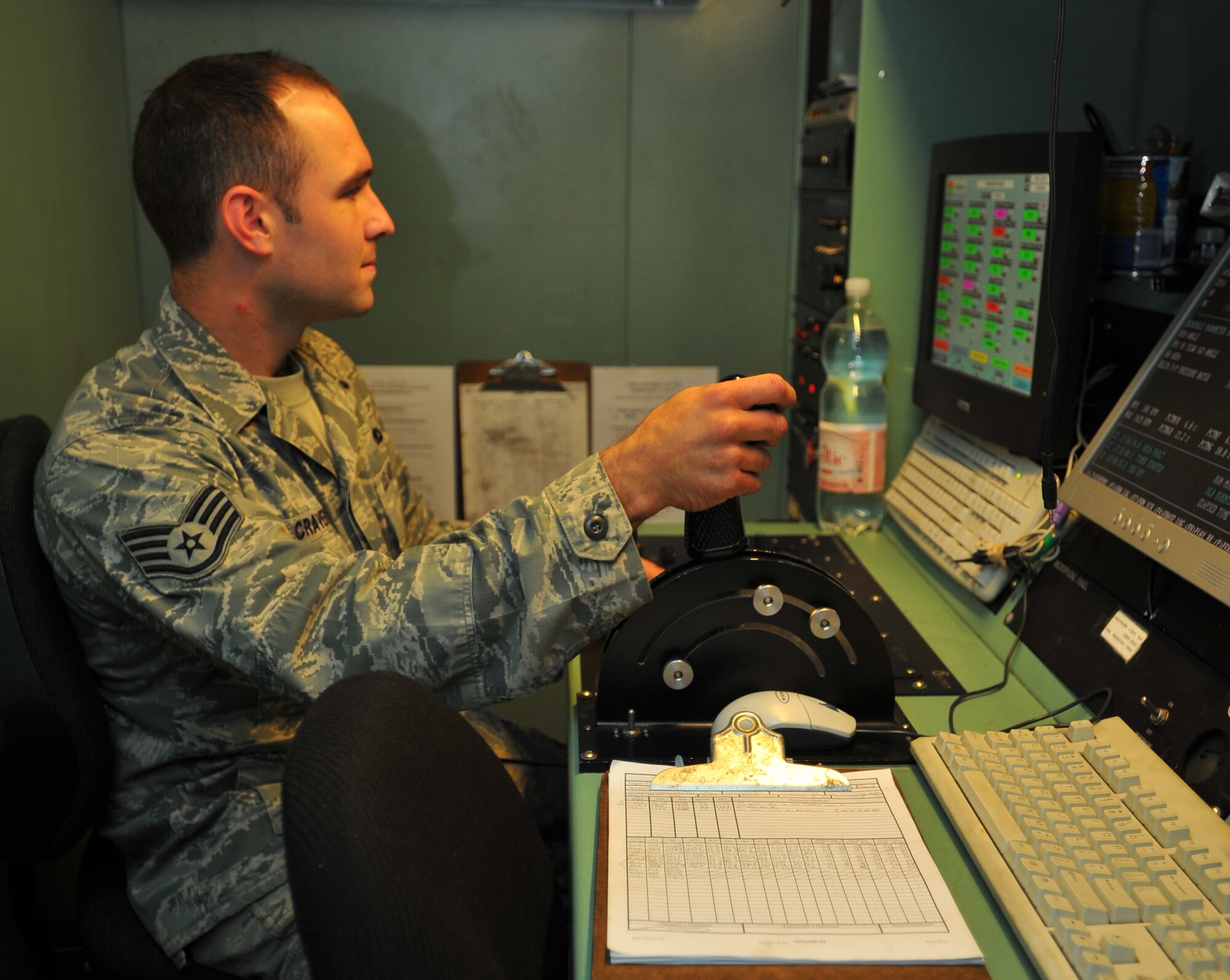 SPANGDAHLEM AIR BASE, Germany – Staff Sgt. Ronald Craven, 52nd Component Maintenance Squadron, powers a jet engine using a wired remote throttle inside the hush house here June 27. The hush house is a sound controlled hangar used to test turbine engines for malfunctions before they are mounted on aircraft. (U.S. Air Force photo/Airman 1st Class Dillon Davis)
