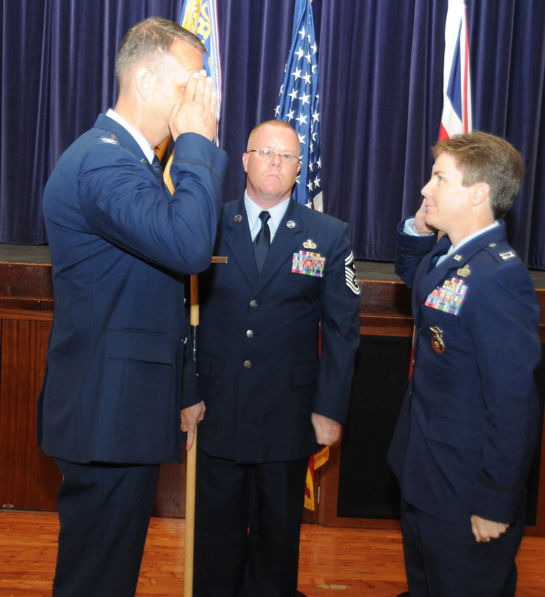 Captain Kelli Green salutes Col. Jeffrey Renner as she assumes command of the 422nd Security Forces Squadron at RAF Croughton June 27.