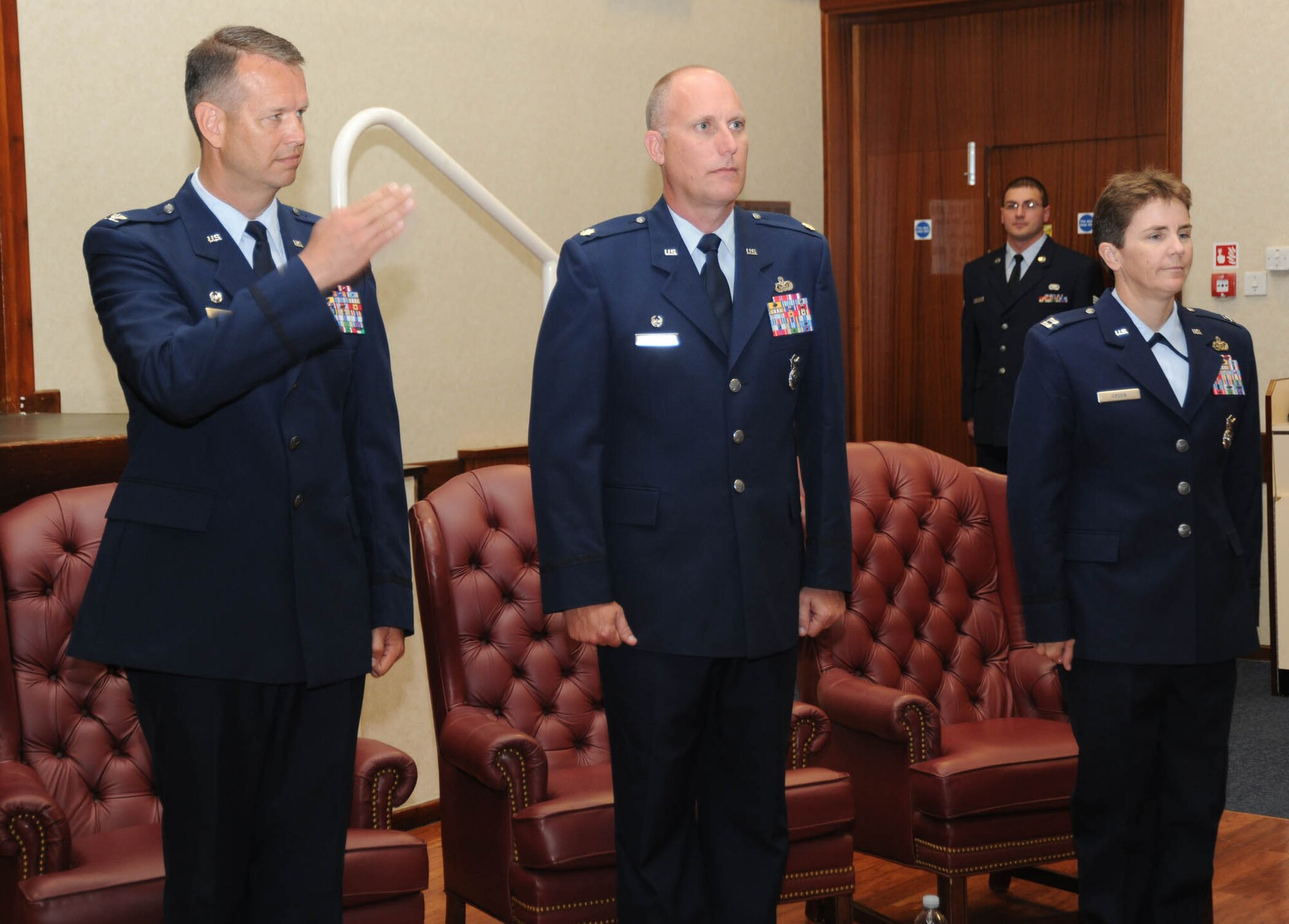 Colonel Jeffrey Renner, 422nd Air Base Group commander, salutes Airmen from the 422nd Security Forces Squadron during a change of command ceremony at RAF Croughton June 27. 