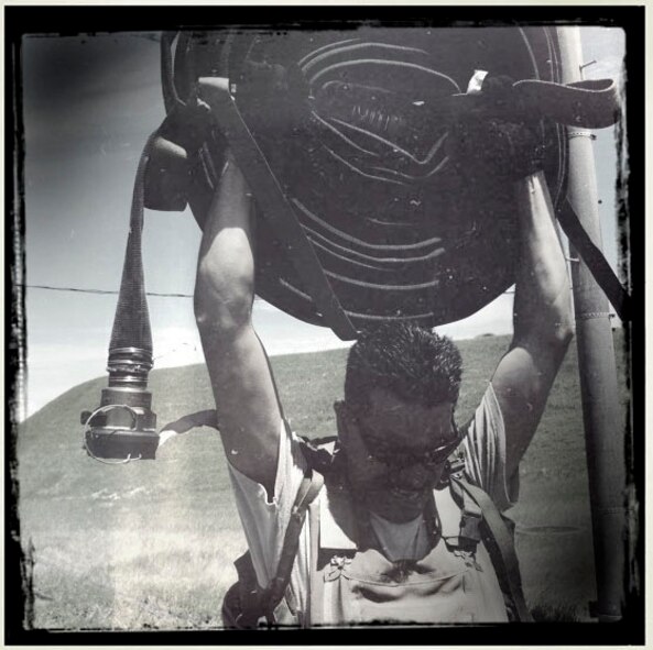 Tech Sgt. Paiea Sugnuma, NCOIC mobile distribution, holds a 200-pound hose over his head during the physical portion of the 18th Logistics Readiness Squadron Forward Ariel Refueling Point tryouts at Kadena Air Base, Japan, June 17. Though the job is defined as an essential wartime capability, FARP has made its presence in the world as a humanitarian aid as well, especially in support of Operation Tomodachi, where U.S. military assets greatly assisted in the relief efforts following the devastating earthquake and tsunami that struck the island of Honshu, Japan, March 11. (U.S. Air Force photo/ Airman 1st Class Brooke P. Beers)