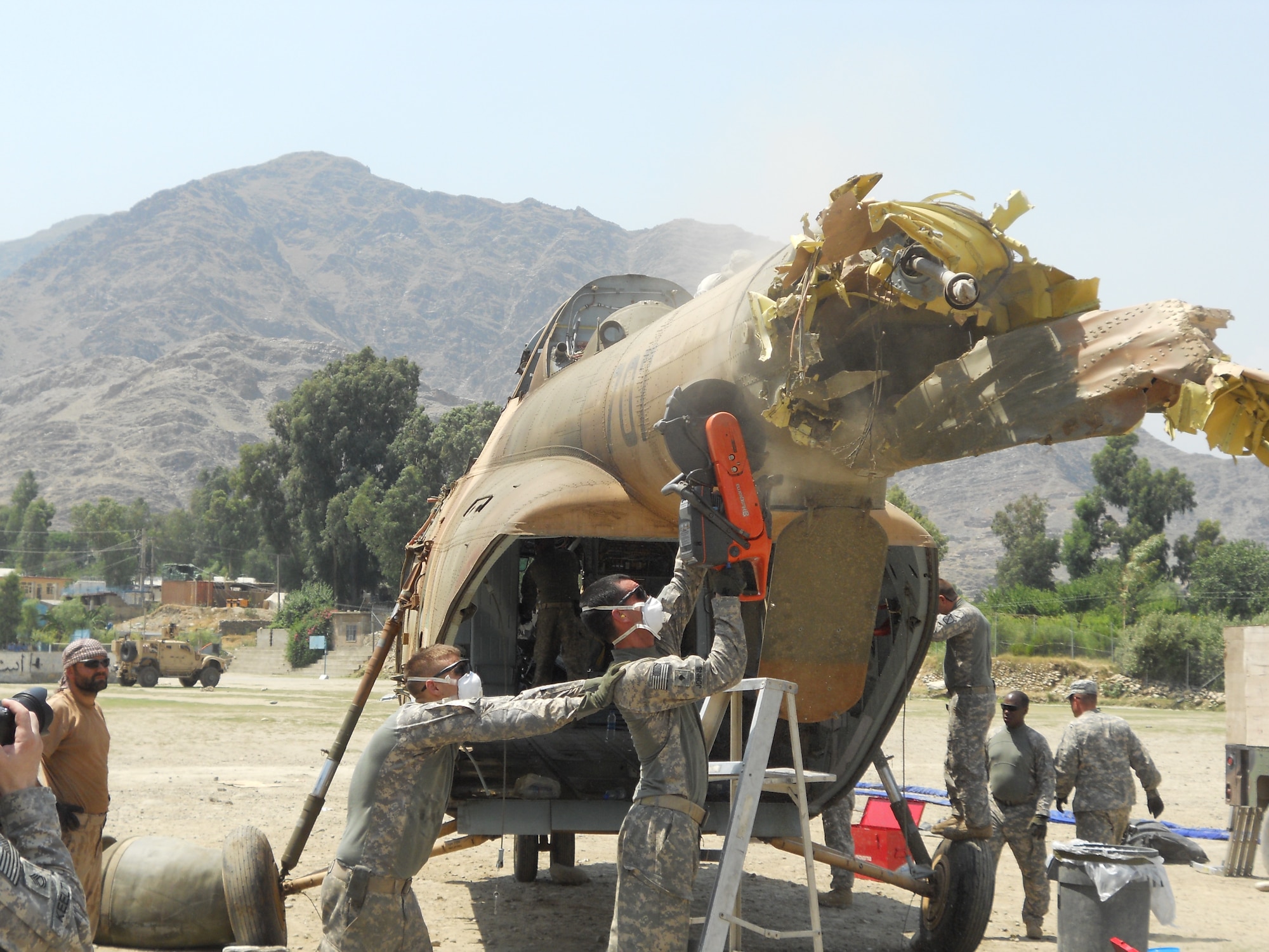 6/15/2011 – ASADABAD, Afghanistan – With support from Task Force Bronco 4, teams removed portions of a Mi-17 helicopter after a crash in Kunar province.  Thirteen members of the 438th Air Expeditionary Wing responded to the incident scene.  There were six people on board the aircraft when it crashed and officials indicate there were no life-threatening injuries.  Airmen were on scene of the crash for more than a week.  (U.S. Air Force courtesy photo)	