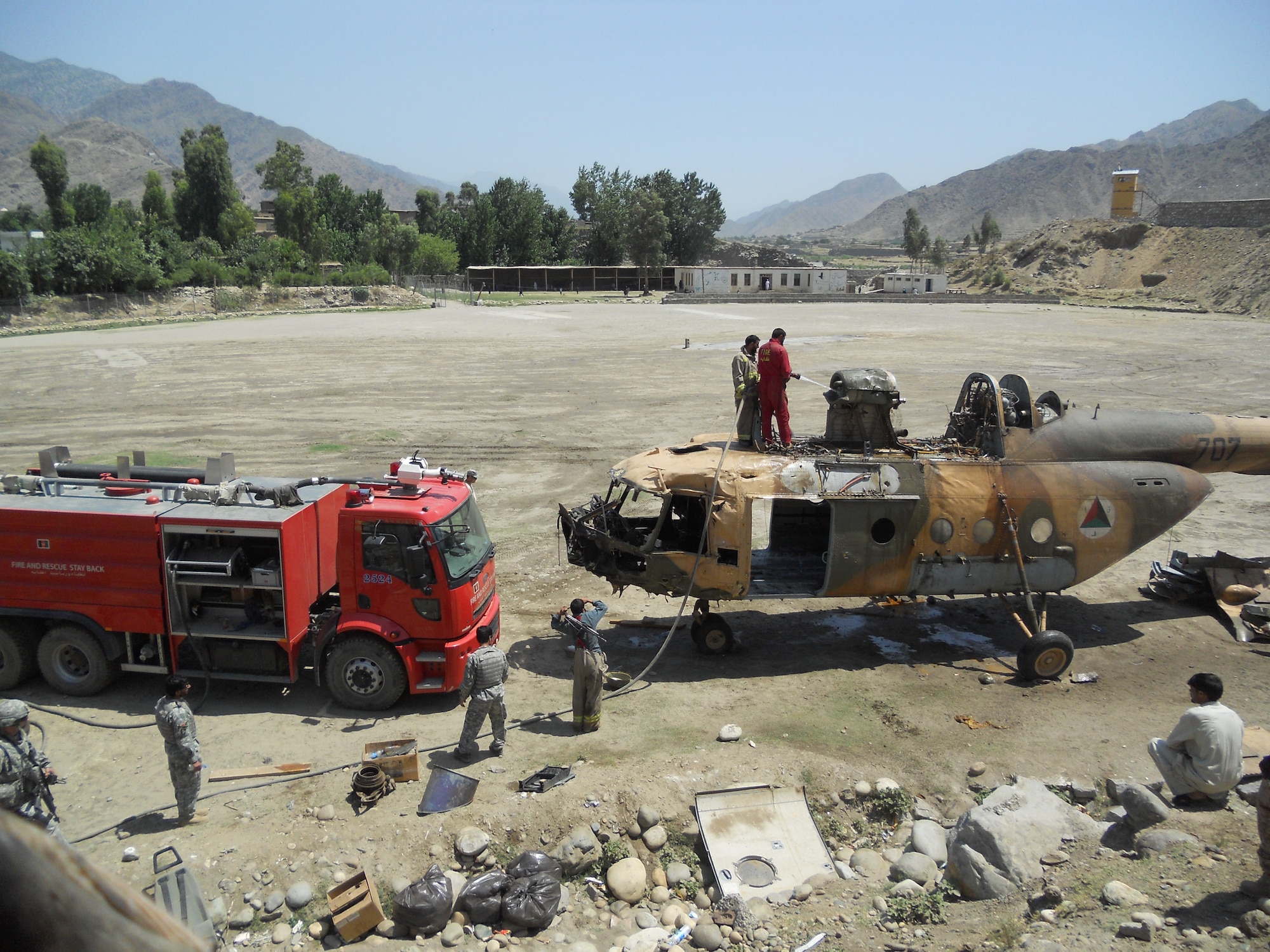 6/15/2011 – ASADABAD, Afghanistan – With support from Task Force Bronco 4, teams removed portions of a Mi-17 helicopter after a crash in Kunar province.  Thirteen members of the 438th Air Expeditionary Wing responded to the incident scene.  There were six people on board the aircraft when it crashed and officials indicate there were no life-threatening injuries.  Airmen were on scene of the crash for more than a week.  (U.S. Air Force courtesy photo)	