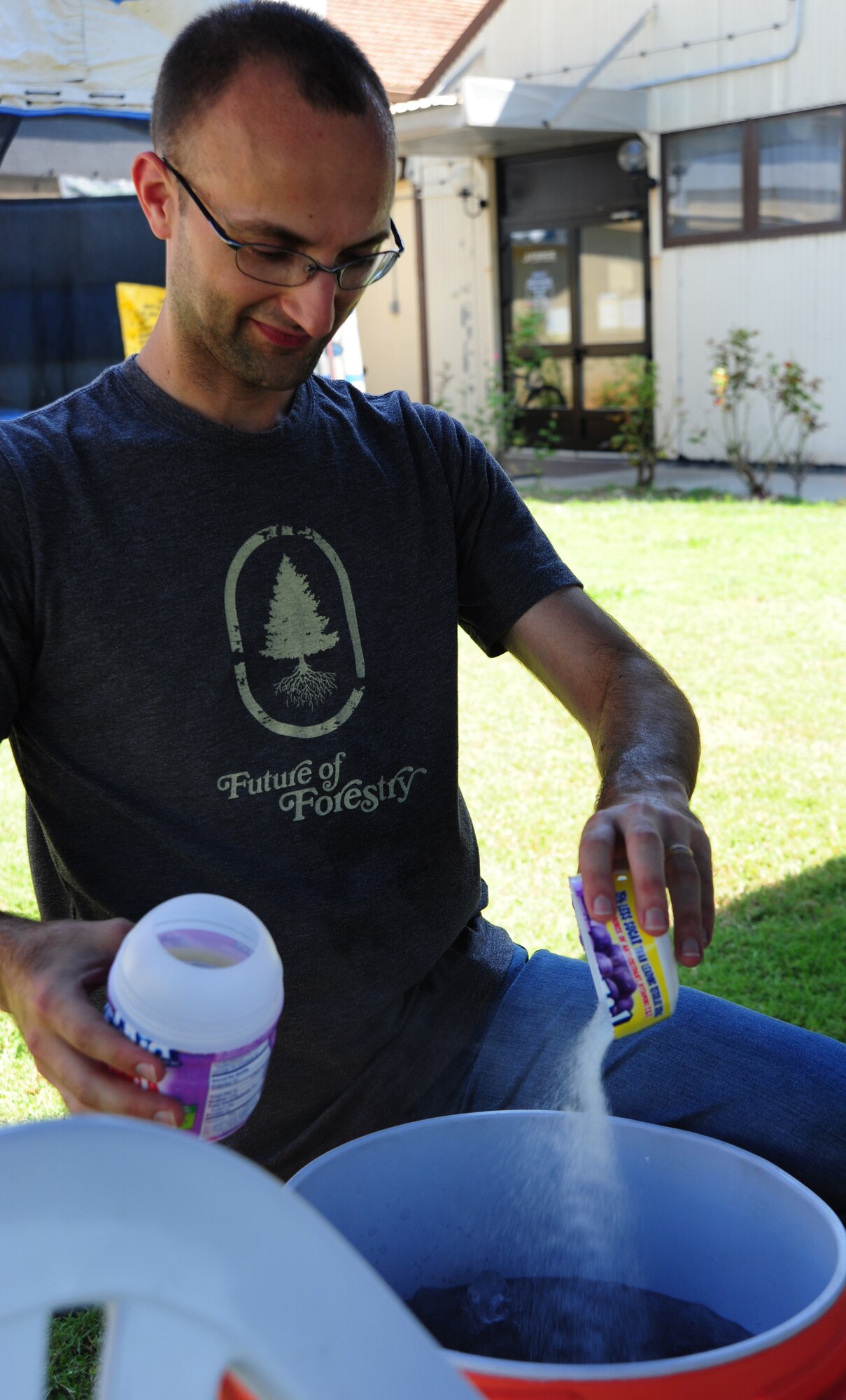 Tech. Sgt. Gail Sesker, 39th Communications Squadron airfield systems technician, makes refreshments for participants during the Summer Reading Kick-Off event June 24, 2011, at Incirlik Air Base, Turkey.  The reading event was a way for children to celebrate summer reading and receive encouragement to read through the summer. (U.S. Air Force photo by Senior Airman Anthony Sanchelli/Released)