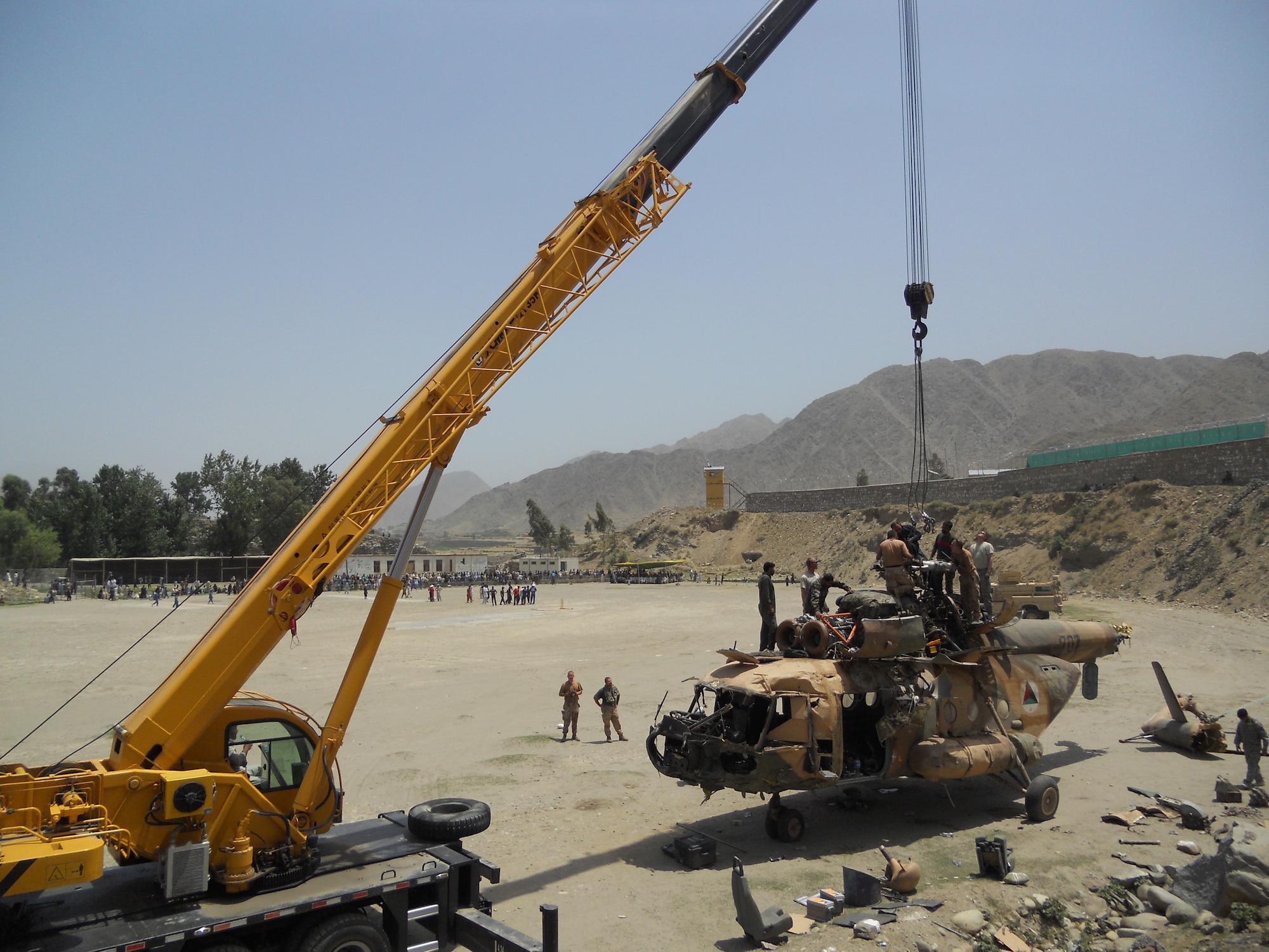 6/15/2011 – ASADABAD, Afghanistan – With support from Task Force Bronco 4, teams removed portions of a Mi-17 helicopter after a crash in Kunar province.  Thirteen members of the 438th Air Expeditionary Wing responded to the incident scene.  There were six people on board the aircraft when it crashed and officials indicate there were no life-threatening injuries.  Airmen were on scene of the crash for more than a week.  (U.S. Air Force courtesy photo)	