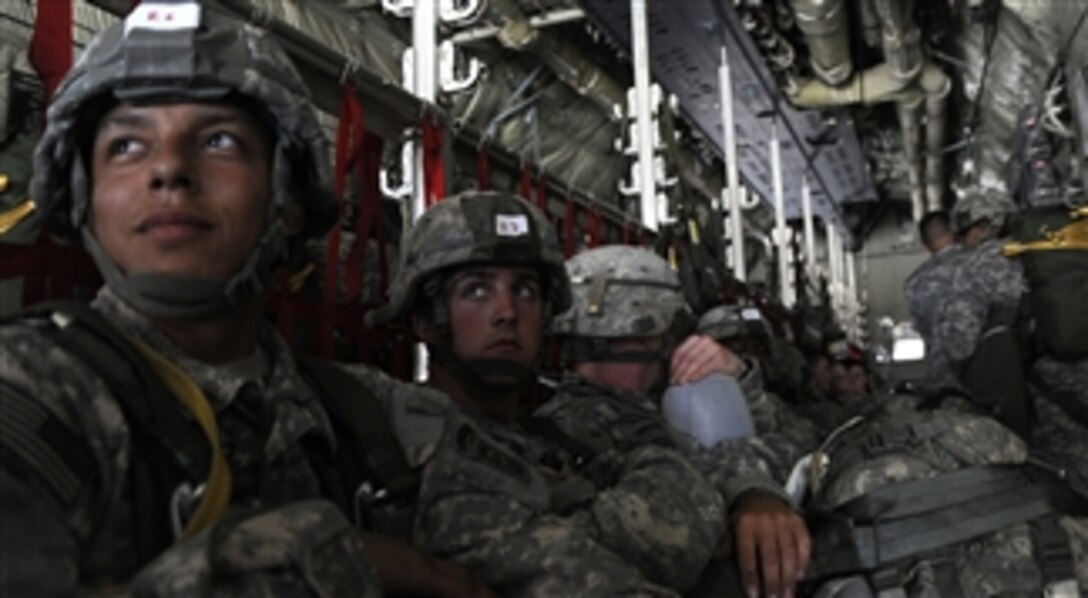 U.S. Army paratroopers sit in a C-17 Globemaster III aircraft during a joint operational access exercise at Fort Bragg, N.C., on June 21, 2011.  A joint operational access exercise is a joint airdrop exercise designed to enhance service cohesiveness between Army and Air Force personnel, allowing both services an opportunity to execute large-scale heavy equipment and troop movement.  
