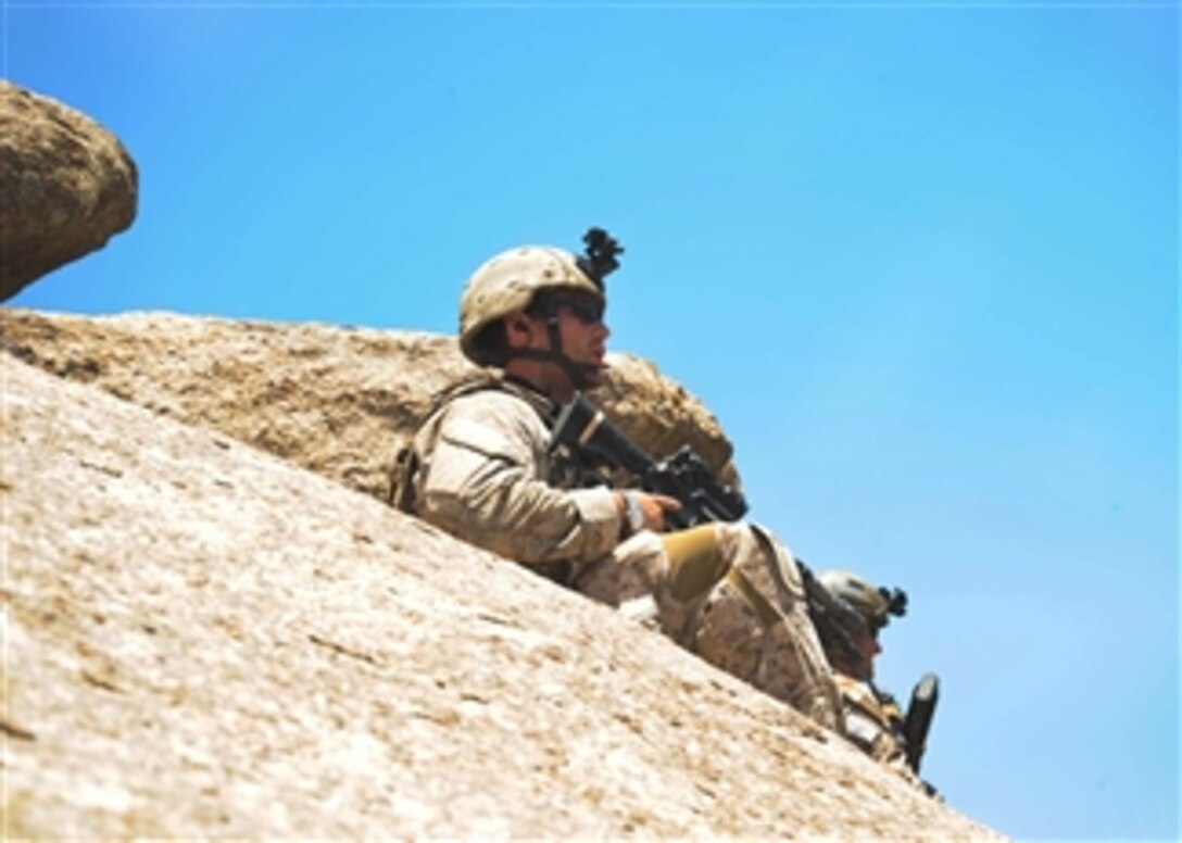 U.S. Special Operations team members keep watch during a combat reconnaissance patrol in Zabul, Afghanistan, on June 19, 2011.  U.S. Special Operations forces are operating with Afghan National Army commandos and other security forces to help stabilize the region.  