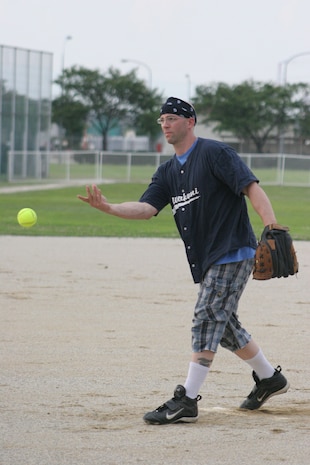 Raymond S. Sawejko, MHQ pitcher, floats a pitch during MHQ's harrowing 10-9 win against the Thunder Chickens in an intramural softball tournament game at the main softball field here June 29. The Chickens attempted to mount a comeback late in the fifth inning but were stopped short.