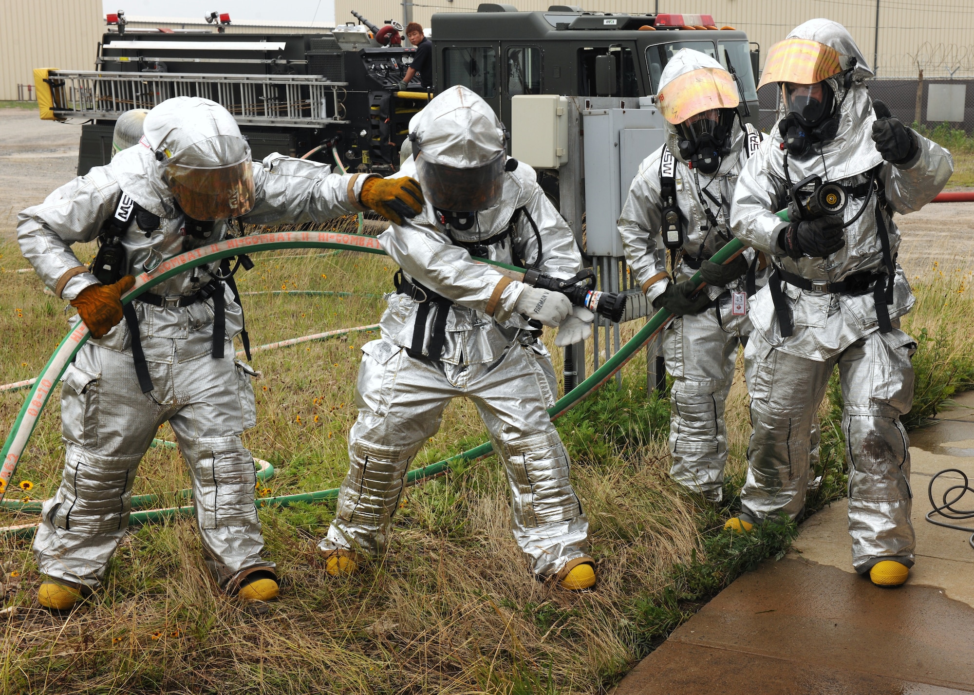 KUNSAN AIR BASE, Republic of Korea -- Wolf Pack leadership prepares to enter a simulated burning building here June 27. In firefighting, a fireman would never go into a dangerous situation in a fire or rescue incident alone. (U.S. Air Force photo/Senior Airman Ciara Wymbs)