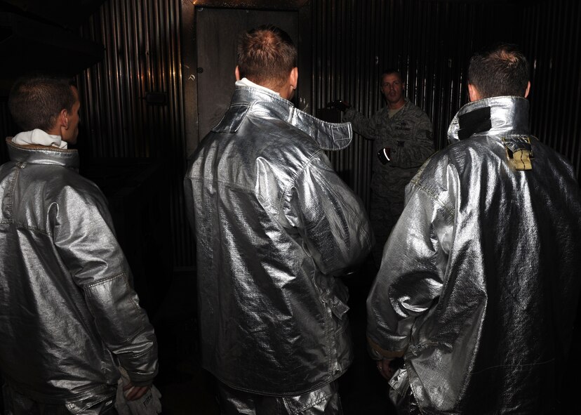 KUNSAN AIR BASE, Republic of Korea -- Tech. Sgt. Matthew Reichle, 8th Civil Engineer Squadron firefighter, explains to base leadership how to extinguish fires here June 27. Training is important because it ensures firefighters are always constant in their abilities. (U.S. Air Force photo/Senior Airman Ciara Wymbs)