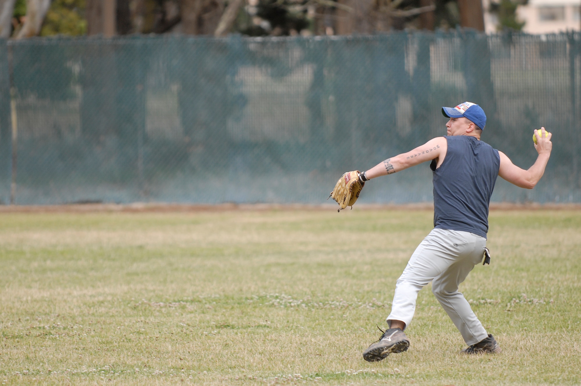 VANDENBERG AIR FORCE BASE, Calif. -- Rodney Franken, a 30th Security Forces Squadron team member, prepares to throw a softball during a softball league game at the baseball field behind the old gym here Tuesday, June 28, 2011.  The 30th SFS team played against the 381st Training Group.  (U.S. Air Force photo/Staff Sgt. Andrew Satran) 
  