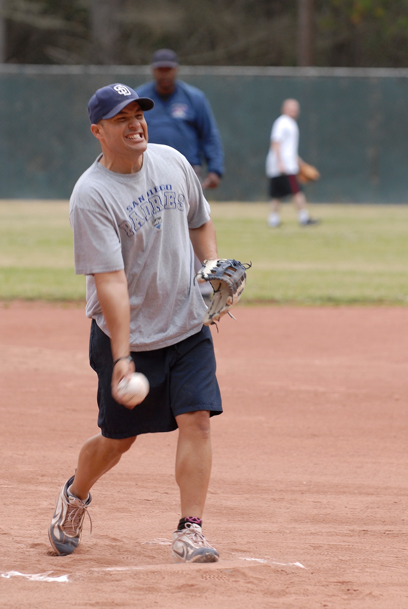 VANDENBERG AIR FORCE BASE, Calif. -- Brian Case, a 30th Security Forces Squadron team member, tosses a softball during an intramural softball game at the baseball field here Tuesday, June 28, 2011.  The 30th SFS team played against the 381st Training Group.  (U.S. Air Force photo/Staff Sgt. Andrew Satran) 

 