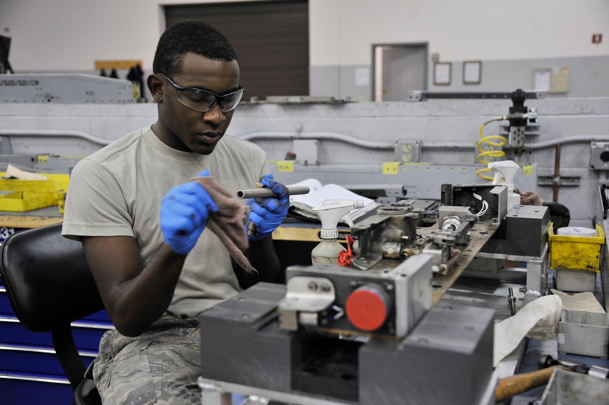 Airman 1st Class Jeremion Chandler cleans and inspects an MAU-12 bomb rack June 23, 2011, Eielson Air Force Base, Alaska. The MAU-12 holds and releases munitions from aircraft. Airman Chandler is an armament technician assigned to the 354th Maintenance Squadron. (U.S. Air Force photo/Staff Sgt. Christopher Boitz)