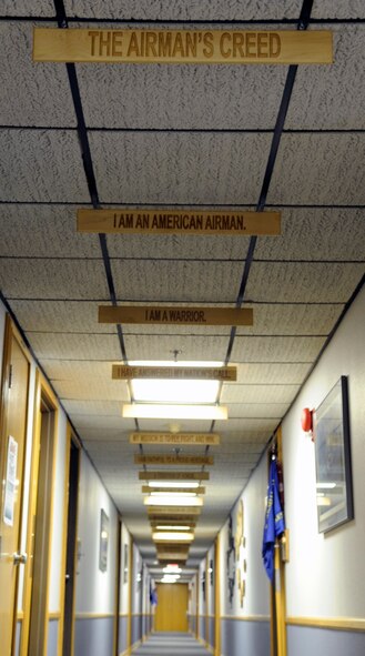 The hallway of the Airman Leadership School at Barksdale Air Force Base, La., quotes the Airman's Creed with wooden plaques. All Airmen in the Air Force must attend ALS prior to becoming NCOs and supervisors. (U.S. Air Force photo/Staff Sgt. John Gordinier)(RELEASED)