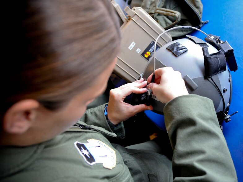 U.S. Air Force Academy cadet Samantha Berthiaume prepares for a flight in an HC-130P Combat King at Moody Air Force Base, Ga., June 28, 2011. On their fifth day at Moody, the visiting cadets were measured and issued head-gear and night vision goggles for their night operations. (U.S. Air Force photo by Airman 1st Class Paul Francis/Released)