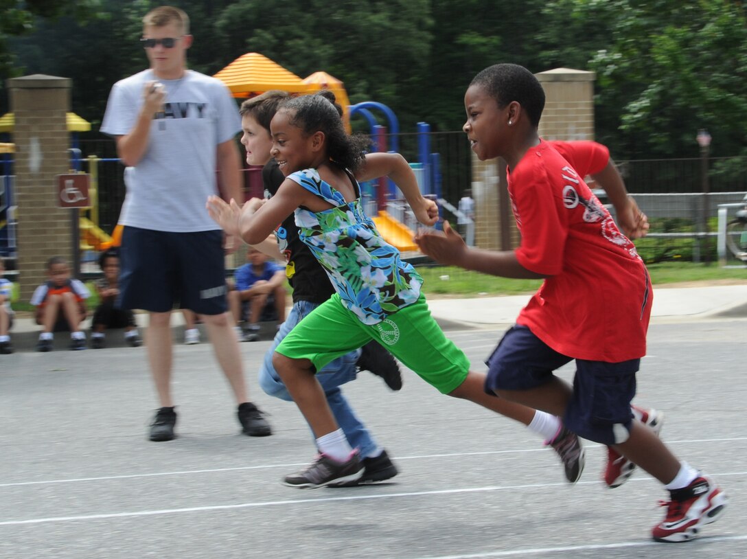 Children from the Andrews Youth Center compete in the 10 meter dash at the Olympic Day celebration June 22.  Former Olympian, Terri Dendy, was the guest of honor.