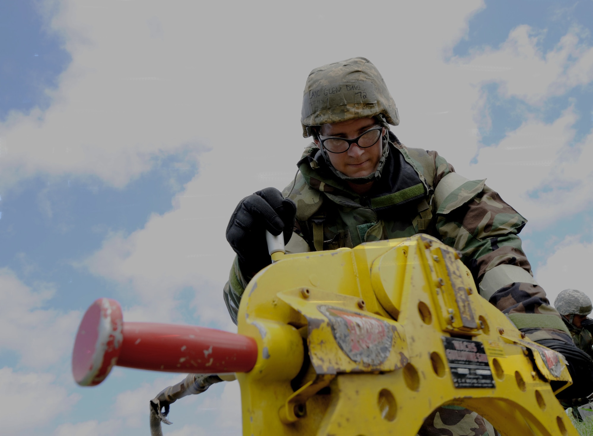 Airman 1st Class Glen Davis uses a piping saw to cut a broken pipeline June 28, 2011, during Silver Flag at Kadena Air Base. Airman Davis is a water and fuel maintenance apprentice assigned to the18th Civil Engineer Squadron. (U.S. Air Force photo/Airman 1st Class Jarvie Z. Wallace)