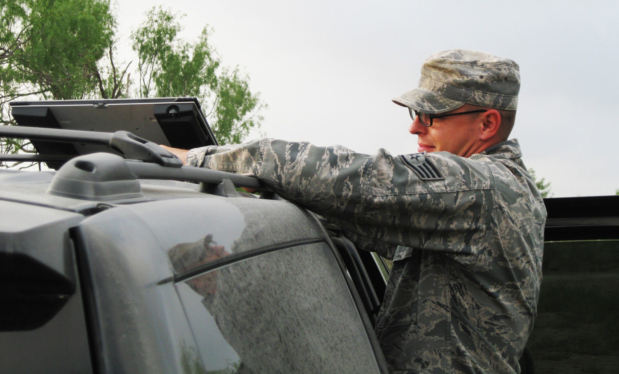 Staff Sgt. Robert Shoemaker, 51st Combat Communications Squadron Hammer Adaptive Communications Element operator, adjusts a satellite which helped provide telephone and Internet services to the on-site commander of the June 15 crash of a Navy T-45 Goshawk in Texas. Courtesy Photo