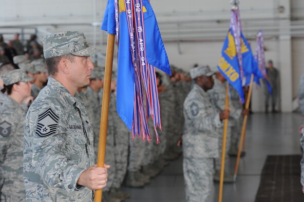 Guidon bearers post during the 1st Special Operations Wing change of command ceremony, Hurlburt Field, Fla., June 29, 2011. Col. Michael Plehn relinquished command to Col. James Slife, previously the 27th Special Operations Group commander at Cannon Air Force Base, N.M. (U.S. Air Force photo by Airman 1st Class Caitlin O’Neil-McKeown/RELEASED)