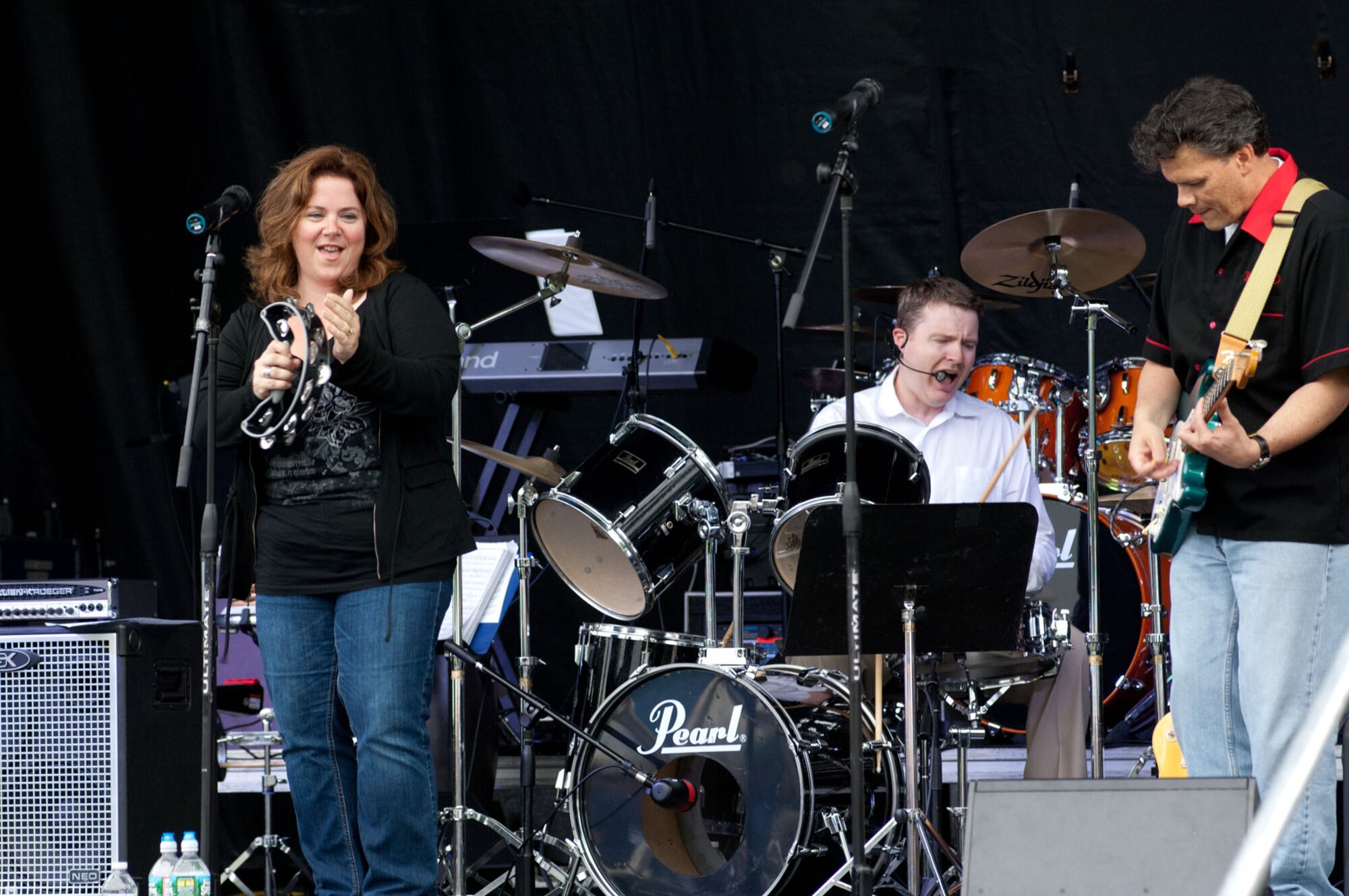 HANSCOM AIR FORCE BASE, Mass. – X-BAND, a rhythm and blues music group, entertain the audience during Summer Bash at Memorial Park June 24. Immediately following Heroes Homecoming, the 66th Force Support Squadron kicked off Summer Bash, with rides, games, food and fun for all. (U.S. Air Force photo by Rick Berry)