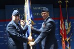 Col. Richard Murphy, 12th Flying Training Wing commander, passes the guidon of command to Lt. Col. Neil Allen, new commander of the 479th Flying Training Group 
at Naval Air Station Pensacola, Fla., Monday.
(U.S Air Force courtesy photo)