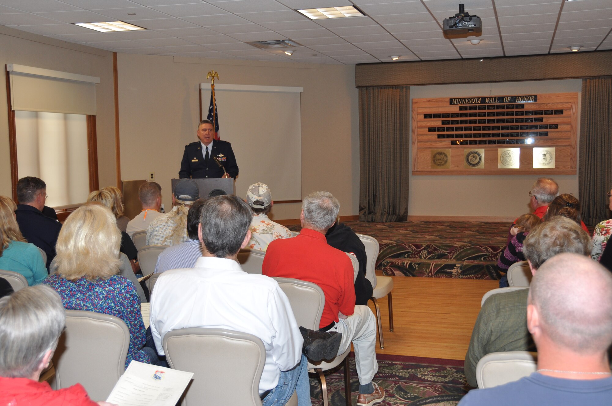 Col. Darrell G. Young, 934th Airlift Wing commander, speaks at the Minnesota Veterans Memorial Wall dedication at the Fort Snelling Officer's Club June 11. The wall honors Minnesota military members killed in action since 9/11. (Air Force Photo/Paul Zadach)