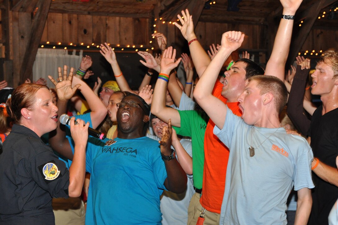 DAHLONEGA, Ga. -- Airman 1st Class Jill Marie Diem, vocalist with the Band of the U.S. Air Force Reserve, sings to a crowd of excited Teen Summit participants. This concert occurred during the Classic Teen Leadership Summit June 22 at the Wahsega 4-H Center in Dahlonega, Ga. (U.S. Air Force photo/Senior Airman Megan Tomkins)