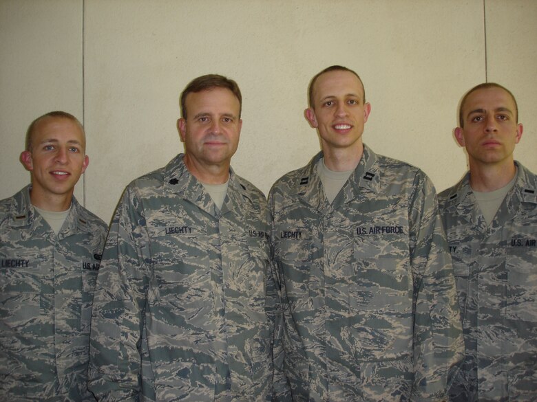 MAXWELL AIR FORCE BASE, Ala. -- Lt. Col. Michael P. Llechty is flanked by his sons 2nd Lt. Michael R. Llechty (left) along with Capt. Jan M. Lletchy and 1st Lt. Kurt M. Lletchy. All are active duty Air Force officers and serve in various regions of America. (Courtesy photo)