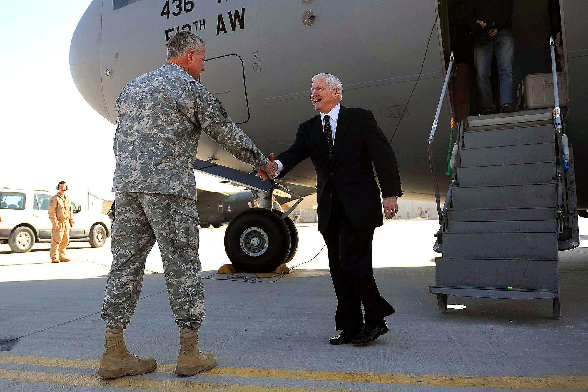Secretary of Defense Robert M. Gates, shown here being welcomed by Army Gen. David McKiernan Dec. 11, 2008, at Kandahar Airfield, Afghanistan, will be retiring June 30, 2011. (Defense Department photo/ Tech Sgt. Jerry Morrison)