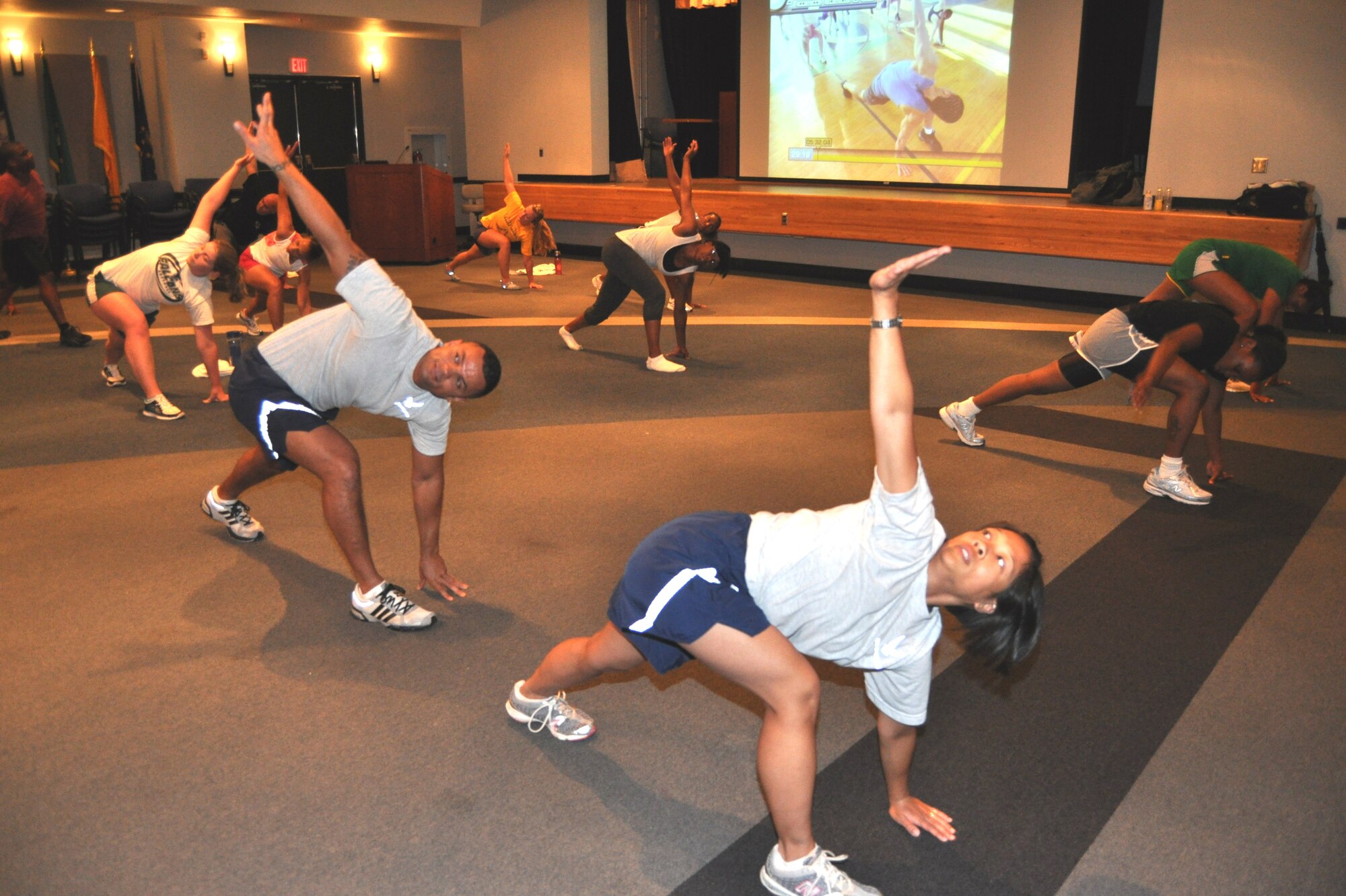“Dragon Medics” work out June 21 in the Keesler Hospital’s Don Wylie Auditorium.
Program initiator Nackeesia Holmes, 81st Surgical Operations Squadron, said the
group does the ‘Insanity’ high intense interval training workout at least three days a
week to promote a healthy lifestyle and bring fitness to the 81st Medical Group.   (U.S. Air Force photo by Steve Pivnick)