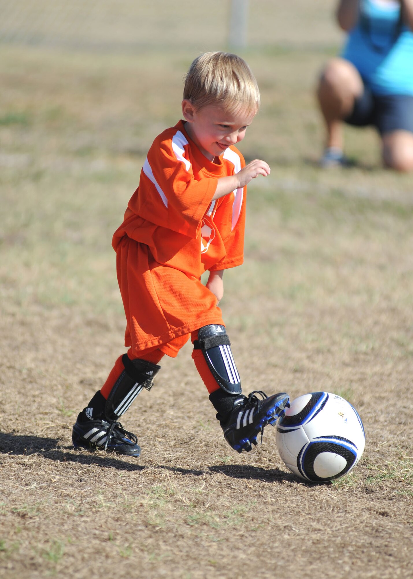 Four-year-old Wyatt Morris, son of Staff Sgt. Trenton and Rachel Bland, 336th Training Squadron, kicks the ball toward the goal during a youth soccer match Saturday.  More than 75 play in the Smart Start program for 3- and 4-year-olds and another 110 play in the league’s other three divisions. The league has 22 teams.  (U.S. Air Force photo by Kemberly Groue)