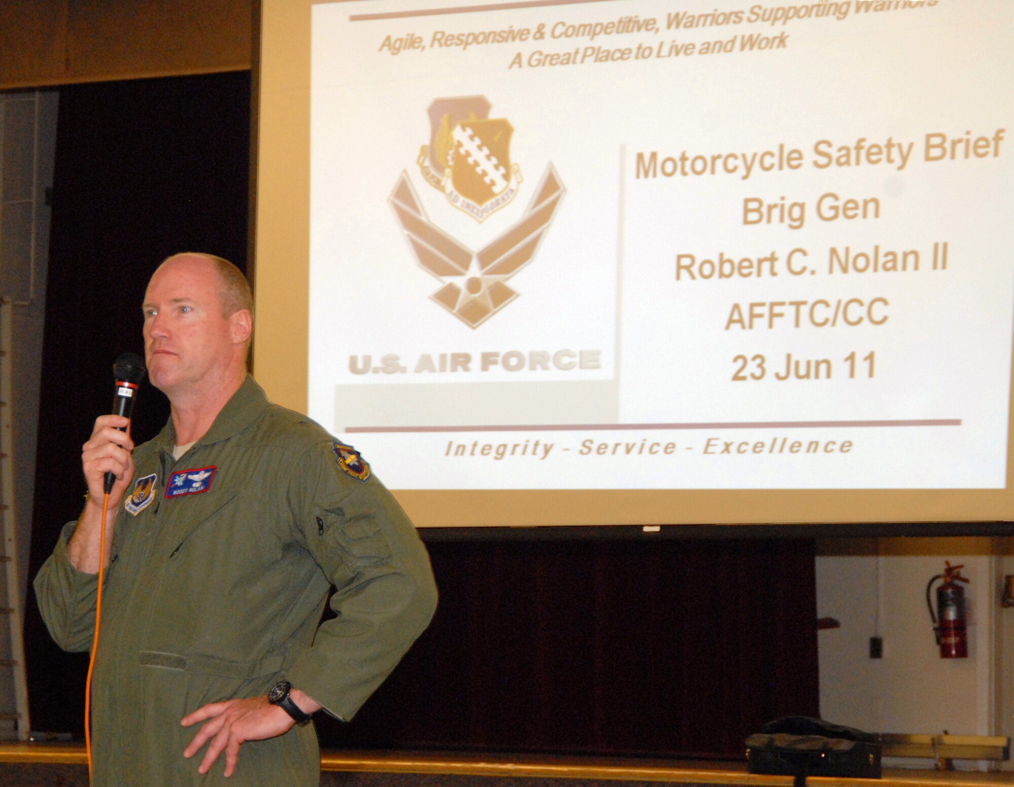 Brig. Gen. Robert C. Nolan II, Air Force Flight Test Center commander, addresses base motorcycle enthusiasts at the Oasis Community Center July 23. The AFFTC held its annual motorcycle safety briefing following the general's remarks. The morning began with a two-and-a-half-hour group motorcycle ride around Edwards. (Air Force photo by Kenji Thuloweit)