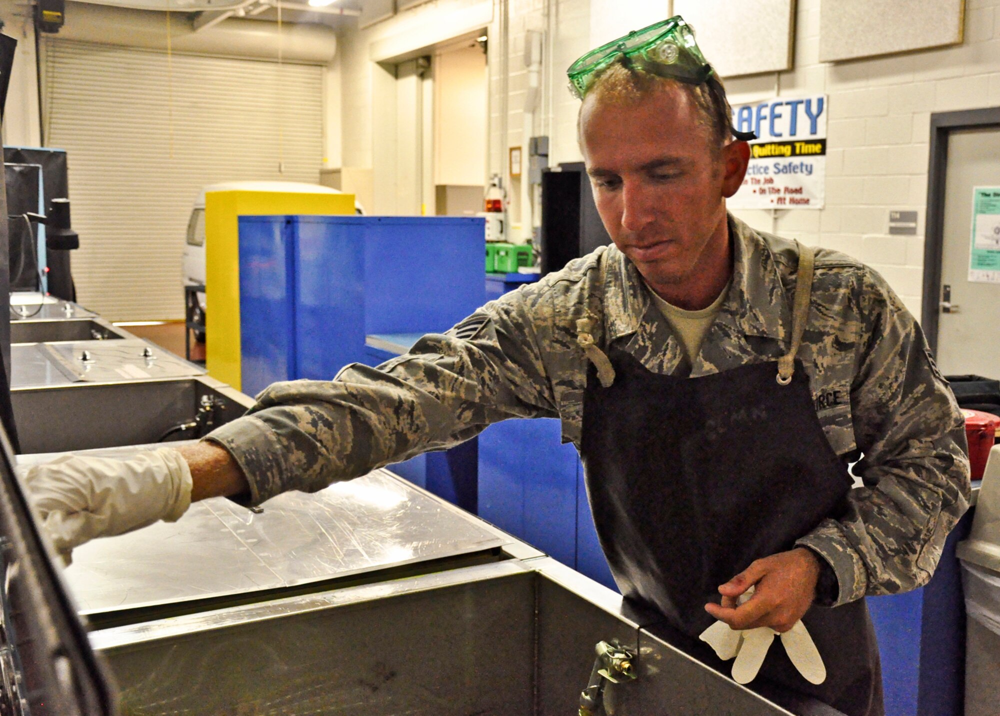 Senior Airman Bradley Levander Jr. prepares the non destructive equipment cleaning station at his shop on June 22, 2011 at Joint Base Charleston, S.C. Airman Levander is assigned to the 315th Maintenance Squadron located at Joint Base Charleston, S.C. (U.S. Air Force Photo/SSgt. Rashard Coaxum)