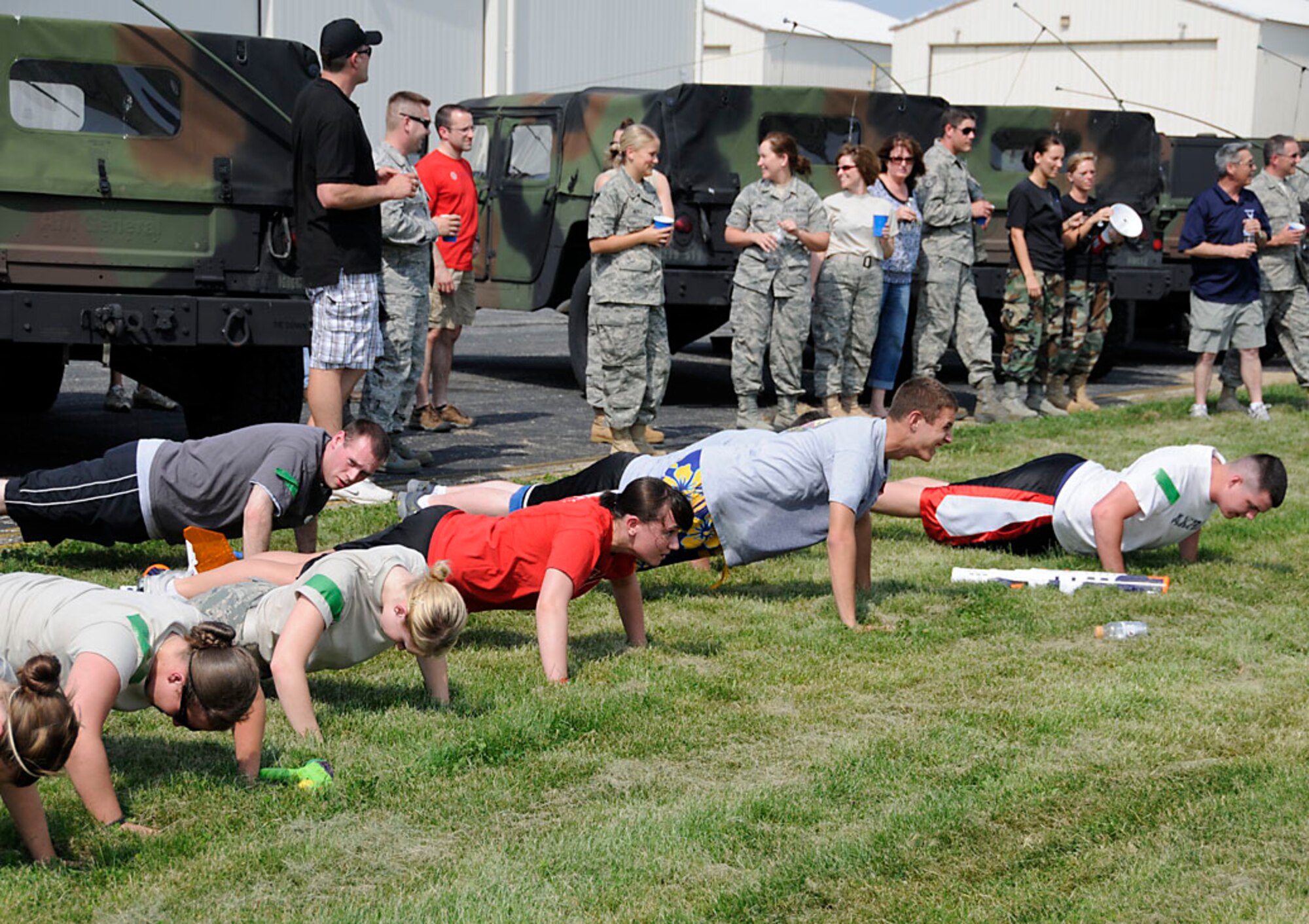 Master Sgt. Andy Vanness, a volunteer referee, forced all but the last team standing do 15 push-ups. One of the perks of being a ref. Photo by Master Sgt. John M.  Day/Released