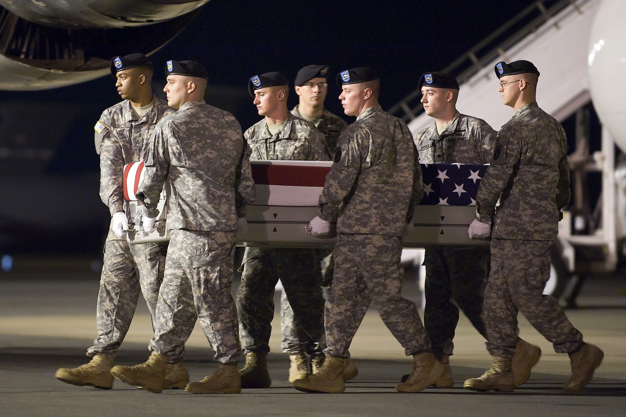 A U.S. Army carry team transfers the remains of Army Spc. Kevin J. Hilaman, of Albany, Calif., at Dover Air Force Base, Del., June 29, 2011. Hilaman was assigned to the 2nd Battalion, 35th Infantry Regiment, 3rd Brigade Combat Team, 25th Infantry Division, Schofield Barracks, Hawaii. (U.S. Air Force photo/Steve Kotecki)