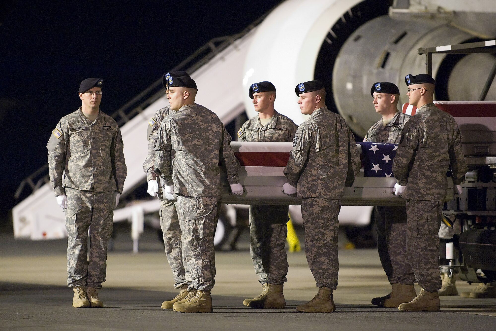 A U.S. Army carry team transfers the remains of Army Spc. Matthew R. Gallagher, of North Falmouth, Mass., at Dover Air Force Base, Del., June 29, 2011. Gallagher was assigned to the 6th Squadron, 9th Cavalry Regiment, 3rd Brigade Combat Team, 1st Cavalry Division, Fort Hood, Texas. (U.S. Air Force photo/Steve Kotecki)