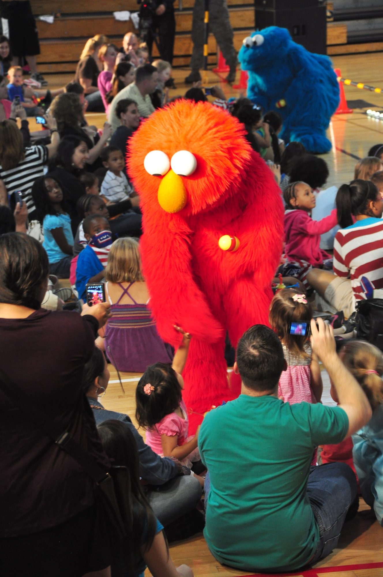 The USO-hosted Sesame Street show made a stop here June 29. This free show, exclusively for military children and their families, features Elmo and his friends Rosita, Cookie Monster, Grover, and their new friend Katie, a military kid who is moving to a new place. The tour is part of Sesame Street's Talk, Listen, Connect initiative for military families. (U.S. Air Force photo/Staff Sgt. Chad Thompson)