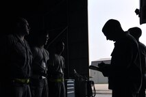 KUNSAN AIR BASE, Republic of Korea -- Senior Airman Ryan Castle, 8th Maintenance Operations Squadron load crew member evaluator, after assessing a load crew from the 80th Aircraft Maintenance Squadron, tells the crew their overall performance. The 8th Maintenance Group provides on- and off-equipment maintenance on F-16 Fighting Falcons. The group also provides munitions, aircraft maintenance and maintenance operations support. (U.S. Air Force photo/Senior Airman Brittany Y. Bateman)