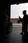 KUNSAN AIR BASE, Republic of Korea -- Senior Airman Ryan Castle, 8th Maintenance Operations Squadron load crew member evaluator, after assessing a load crew from the 80th Aircraft Maintenance Squadron, tells the crew their overall performance. The 8th Maintenance Group provides on- and off-equipment maintenance on F-16 Fighting Falcons. The group also provides munitions, aircraft maintenance and maintenance operations support. (U.S. Air Force photo/Senior Airman Brittany Y. Bateman)