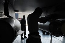 KUNSAN AIR BASE, Republic of Korea -- Senior Airman Ryan Castle, 8th Maintenance Operations Squadron load crew member evaluator, assesses a load crew from the 80th Aircraft Maintenance Squadron. Load crews are evaluated and have to qualify quarterly. (U.S. Air Force photo/Senior Airman Brittany Y. Bateman) 