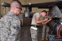 KUNSAN AIR BASE, Republic of Korea -- Senior Airman Ryan Castle, 8th Maintenance Operations Squadron load crew member evaluator, assesses a load crew from the 80th Aircraft Maintenance Squadron. Load crews are evaluated and have to qualify quarterly. (U.S. Air Force photo/Senior Airman Brittany Y. Bateman) 