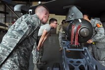 KUNSAN AIR BASE, Republic of Korea -- Senior Airman Ryan Castle, 8th Maintenance Operations Squadron load crew member evaluator, assesses a load crew from the 80th Aircraft Maintenance Squadron. Load crews are evaluated and have to qualify quarterly. (U.S. Air Force photo/Senior Airman Brittany Y. Bateman) 